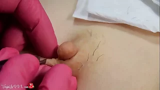 Man Beautician Plucks Whisker not susceptible Nipples be worthwhile for Girl not susceptible Depilation and Massaging Bosom In Red Latex Gloves