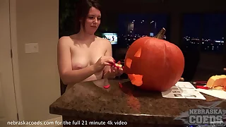 hot teen babe carving a pumpkin jack-o-lantern for halloween unreliably fucking well-found